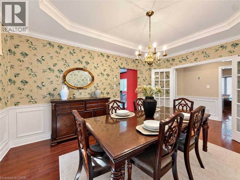Hardwood flooring, crown molding, wall paneling, chandelier lighting, and French doors - 74 Davidson Boulevard, Dundas, ON