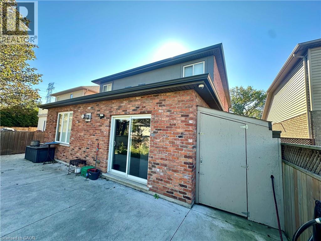 Brick exterior with sliding glass doors - 5 Arden Avenue, Hamilton, ON