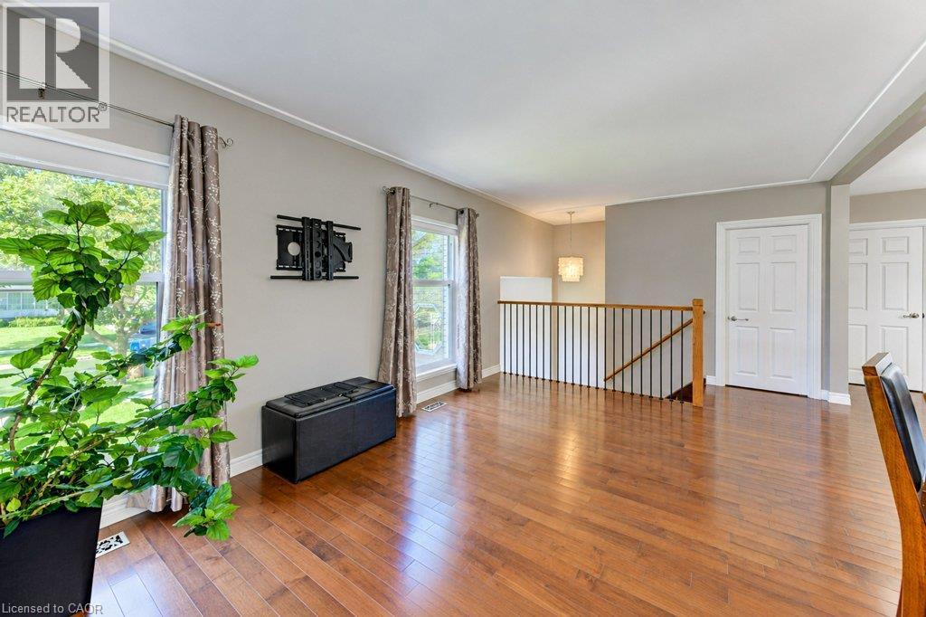 Gleaming hardwood floors in spacious open concept kitchen and living room - 34 Wayne Drive, Kitchener, ON