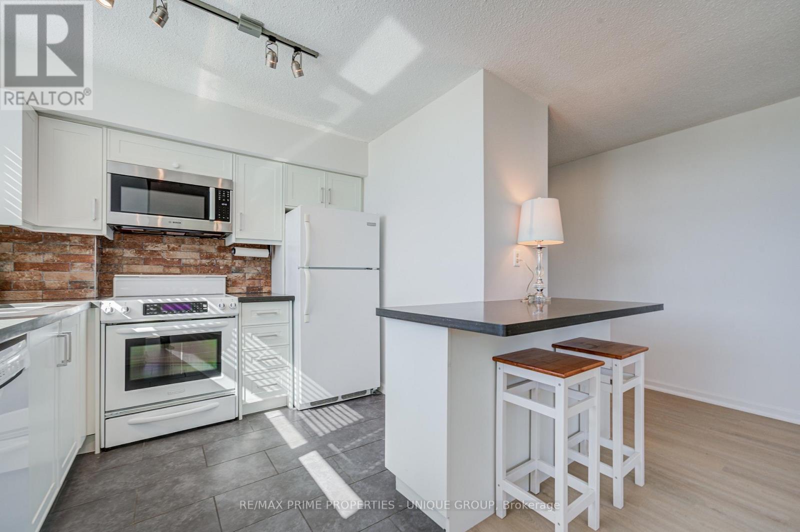 Kitchen with tile floors. - 301 - 250 Queens Quay W, Toronto, ON