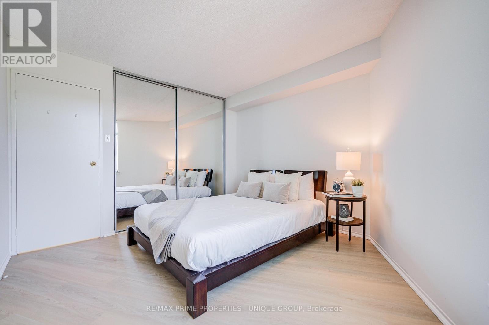 Bedroom with closet and luxury vinyl plank floors. - 301 - 250 Queens Quay W, Toronto, ON