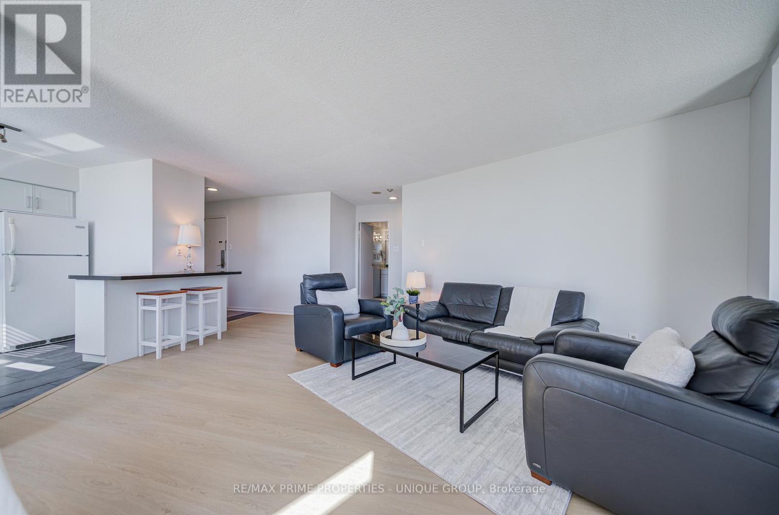 Living room with view towards breakfast counter. - 301 - 250 Queens Quay W, Toronto, ON