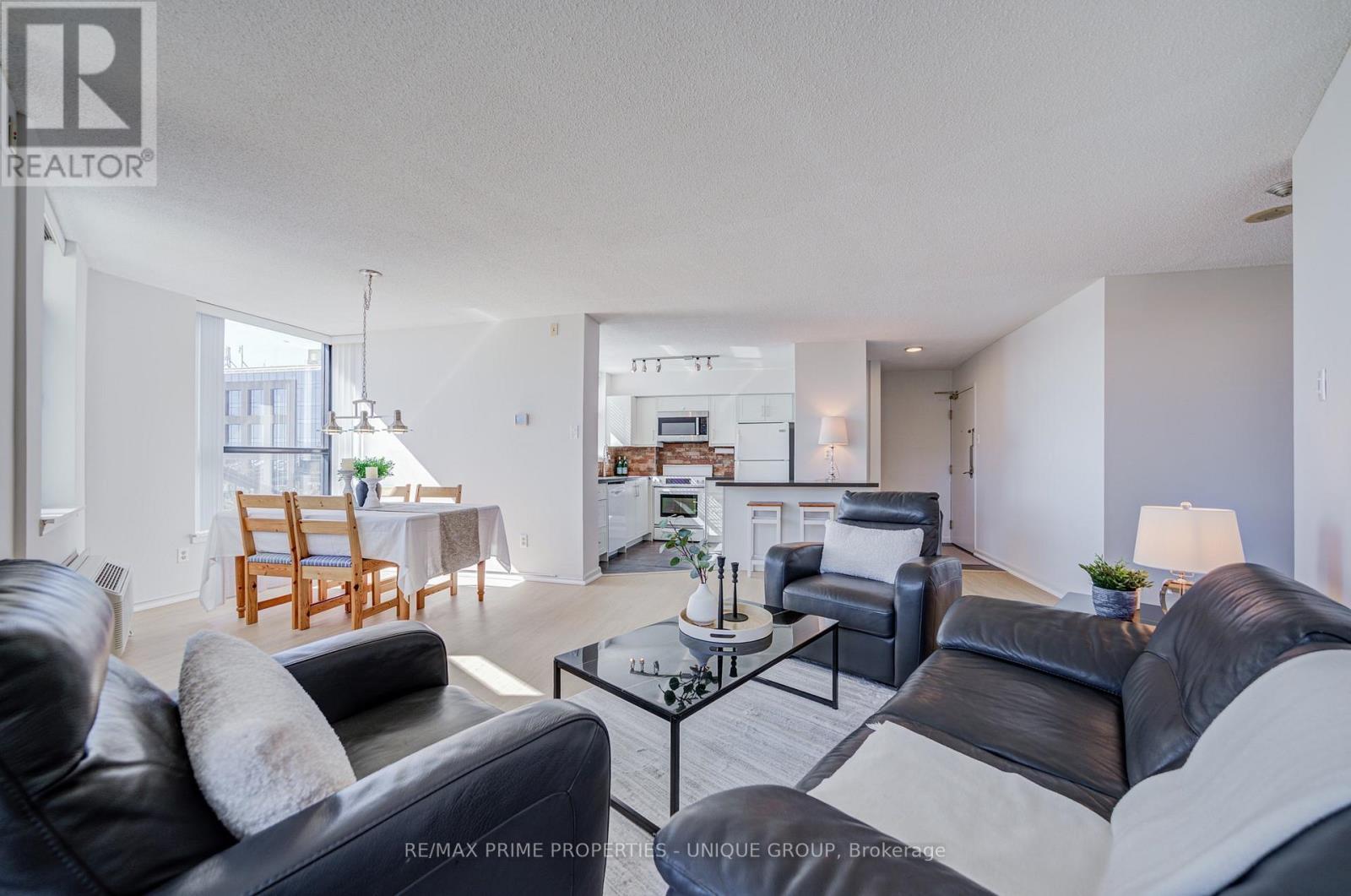 View from den towards living/dining and kitchen. - 301 - 250 Queens Quay W, Toronto, ON