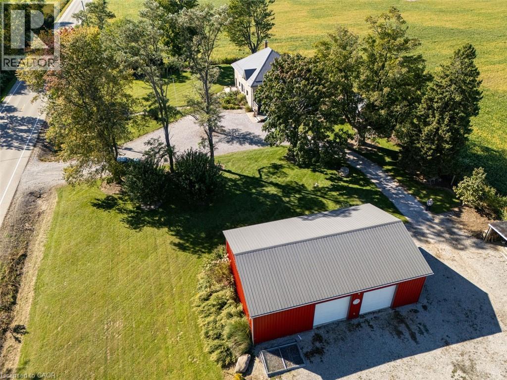 Aerial view of house and shop - 1635 Lakeshore Road, Clear Creek, ON