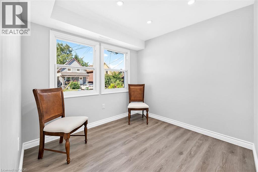 Recessed lighting, wood-finish flooring, white trim, and two windows - 4 Albemarle Street, Hamilton, ON