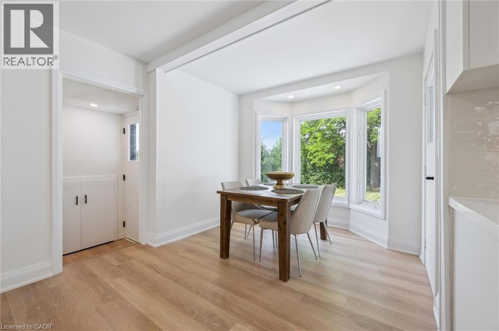 Light wood-finish flooring complements the bright interior paint - 299 Dale Crescent, Waterloo, ON