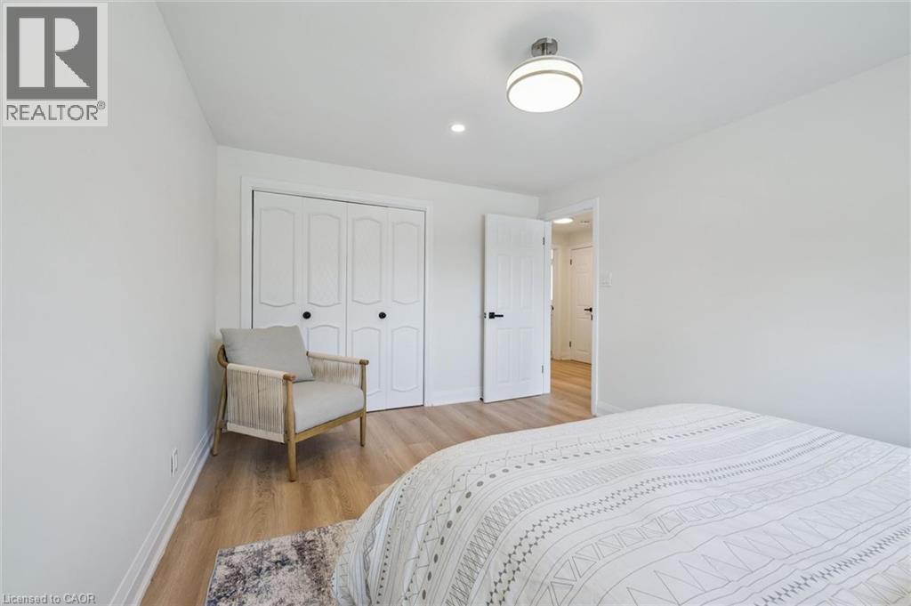 Bright interior featuring light wood-finish flooring and white walls - 299 Dale Crescent, Waterloo, ON