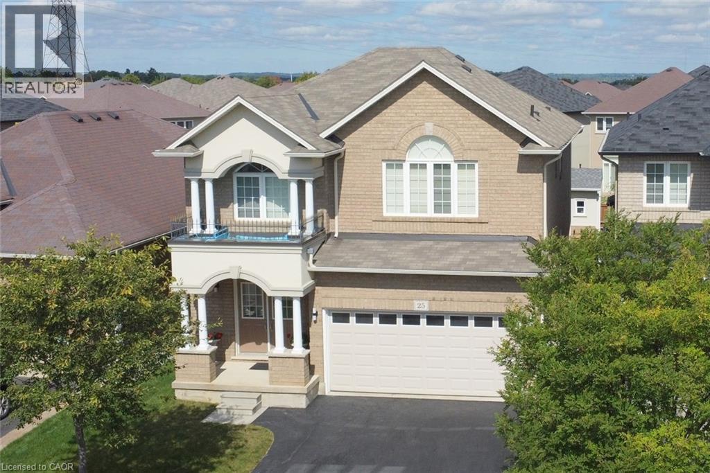 Brick and stucco exterior with an arched entryway - 25 Guest Street, Hamilton, ON