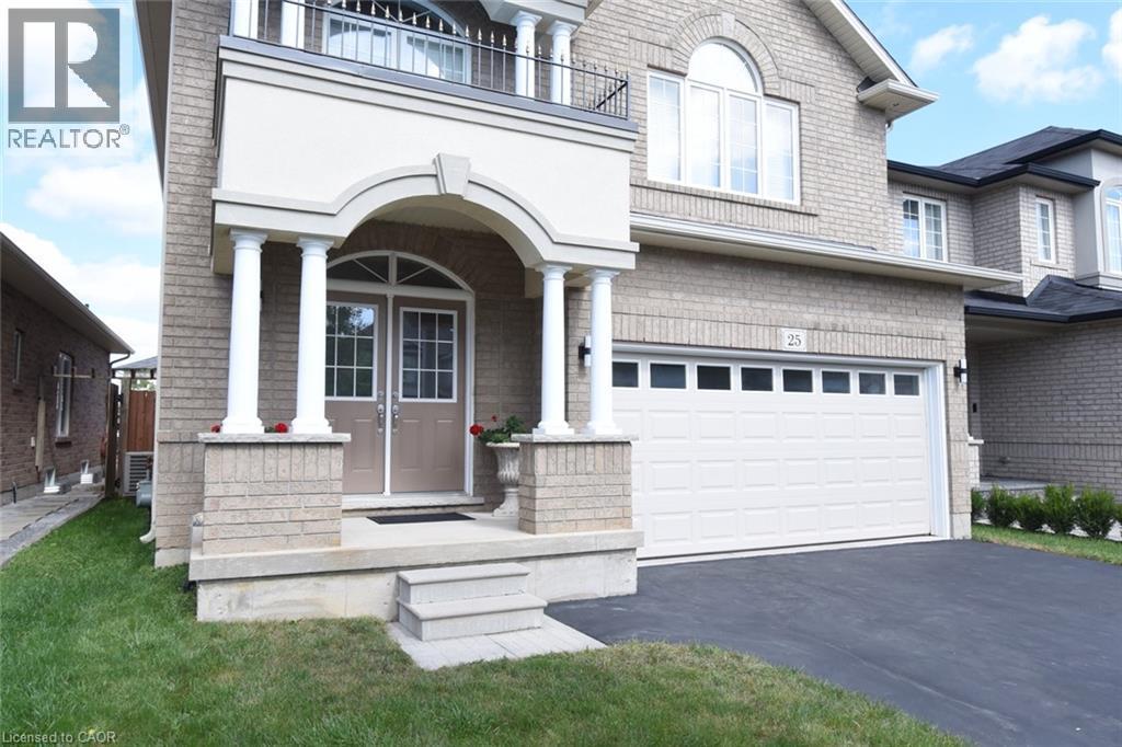 Brick exterior with a prominent arched entry, double front doors, and an attached two-car garage - 25 Guest Street, Hamilton, ON