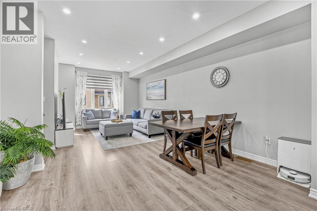 Recessed lighting, wood-finish flooring, light grey walls, and window treatments - 1890 Rymal Road E Unit# 144, Hamilton, ON