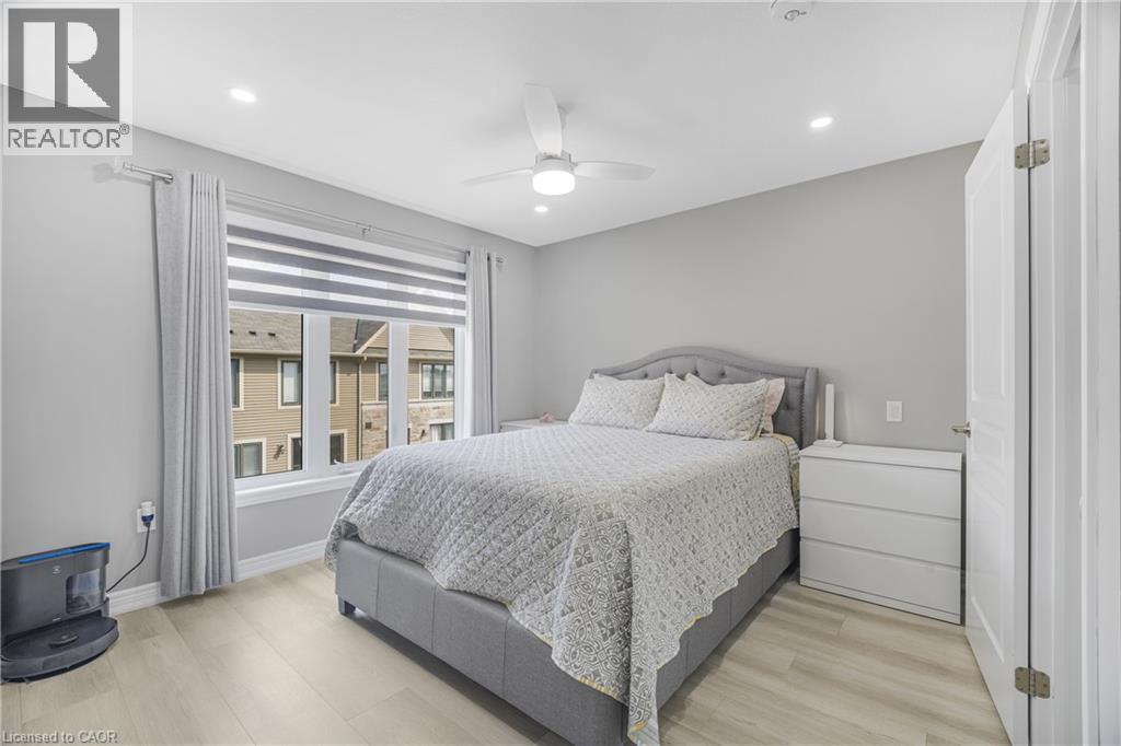 Recessed lighting, ceiling fan, wood-finish flooring, and a window with blinds - 1890 Rymal Road E Unit# 144, Hamilton, ON