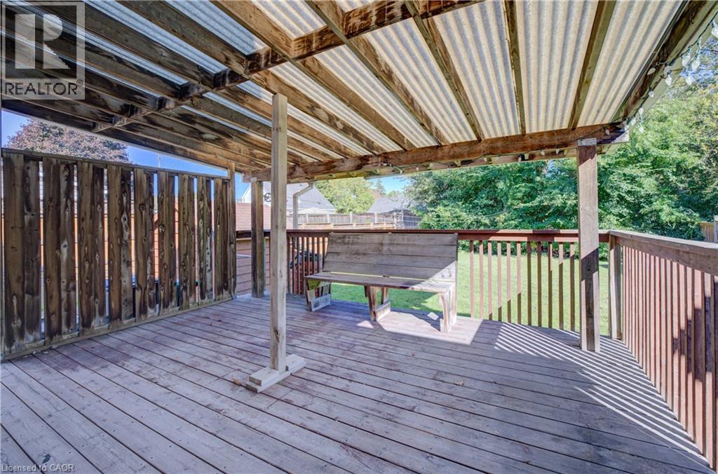 Deck with a wood floor, and wood railings - 174 Bridgeport Road E, Waterloo, ON