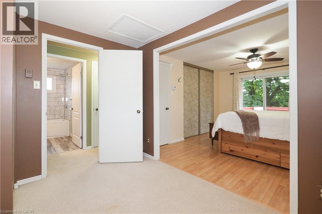 2nd bedroom open to primary bedroom. Can easily be enclosed for a separate bedroom. - 219 Foxhunt Road, Waterloo, ON