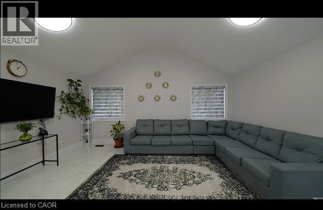 Vaulted ceiling with flush-mount lighting - 643 Doon South Drive, Kitchener, ON