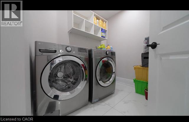 Laundry area featuring white tile flooring and wall-mounted shelving - 643 Doon South Drive, Kitchener, ON