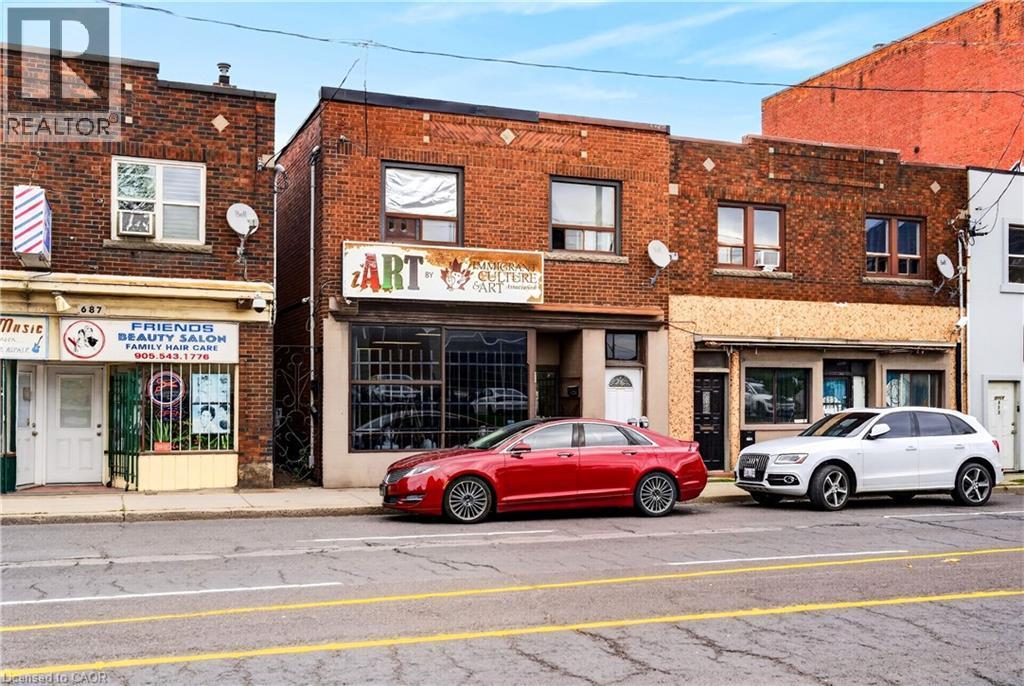 Brick exterior with multiple retail storefronts - 689 E Barton Street E, Hamilton, ON