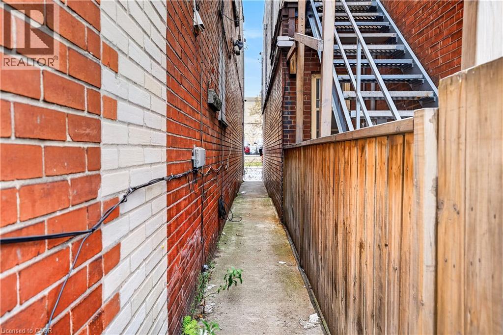 Brick exterior with white painted accents - 689 E Barton Street E, Hamilton, ON