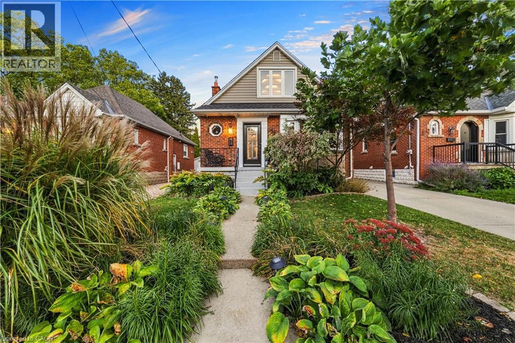 Brick exterior with siding accent. Low maintenance front garden with perennials. - 58 Uplands Avenue, Hamilton, ON