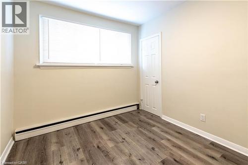 Wood-finish flooring with a horizontal grain pattern - 499 East 16Th Street, Hamilton, ON 