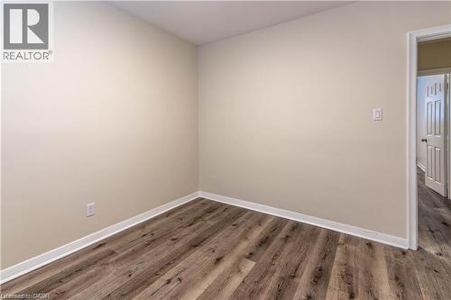 Wood-finish flooring with light-toned walls - 499 East 16Th Street, Hamilton, ON 