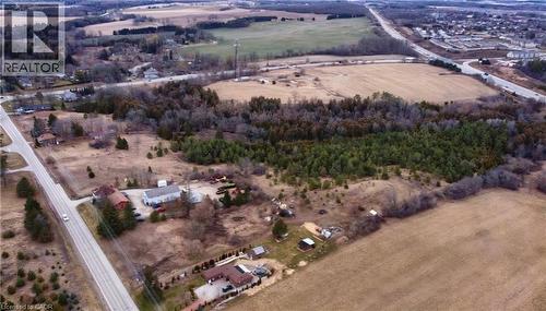 Expansive land parcel featuring open fields, wooded areas, and proximity to paved roadways - 1720 Beaverdale Road, Cambridge, ON 
