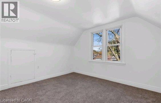 Recessed lighting, sloped ceiling, double-hung windows, wall-to-wall carpeting, and baseboard trim - 284 Brucedale Avenue E, Hamilton, ON