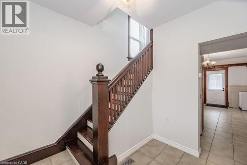 Staircase with wood-finish newel post and balusters - 275 Main Street, Cambridge, ON 