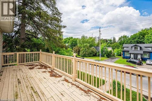 Upper-level deck with wood-finish flooring and railing - 275 Main Street, Cambridge, ON 