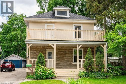 Two-story residence featuring a stone and siding exterior - 275 Main Street, Cambridge, ON 