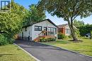 White brick exterior with black framed windows - 311 East 14Th Street, Hamilton, ON 