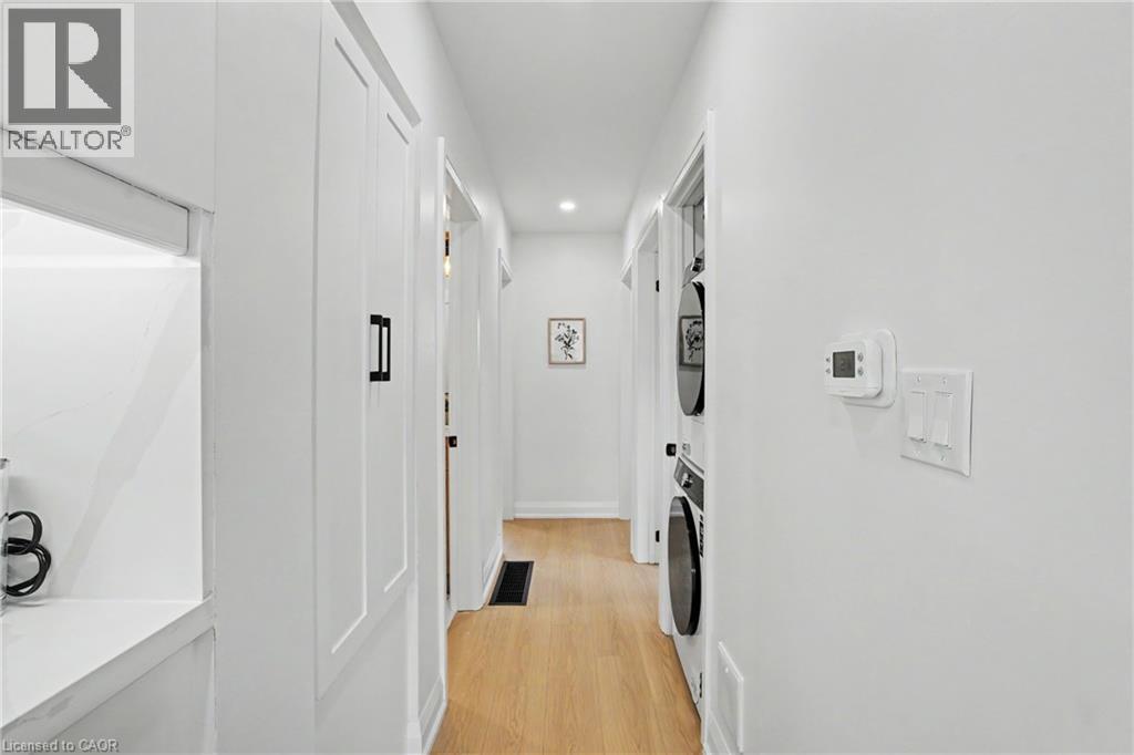 Hardwood-style flooring, recessed lighting, and white walls - 311 East 14Th Street, Hamilton, ON