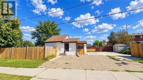 White exterior with brown trim and roof - 76 Avenue Road, Cambridge, ON 