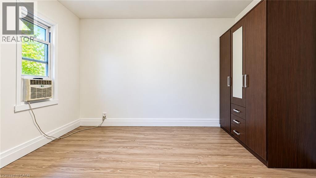 Wood-finish flooring with crisp white walls - 76 Avenue Road, Cambridge, ON