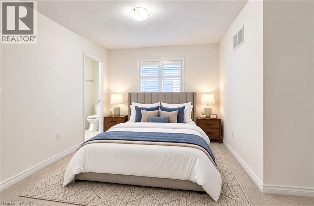 Recessed lighting, window with plantation shutters, wood-finish flooring, and light-colored carpeting - 52 Pointer Street, Cambridge, ON