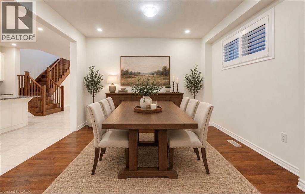 Recessed ceiling lighting illuminates the dining area with wood-finish flooring - 52 Pointer Street, Cambridge, ON