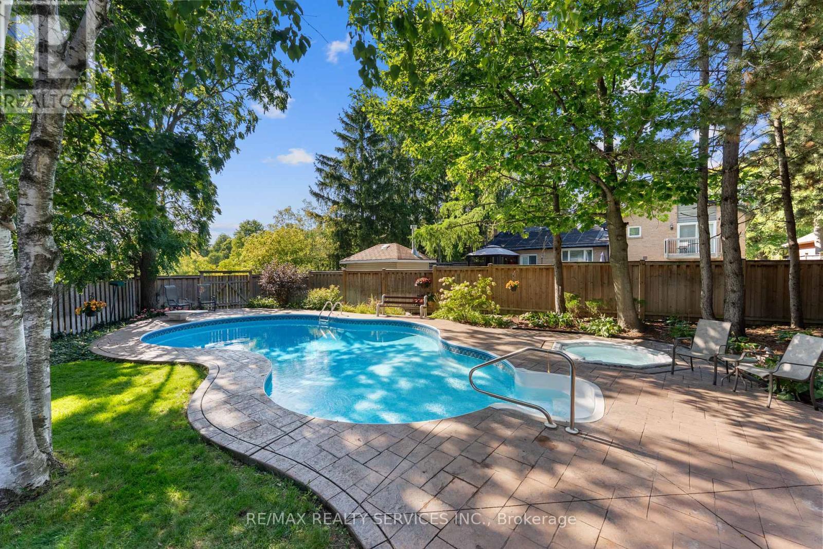 Backyard oasis with heated pool and hot tub - 22 Oldham Crescent, Brampton, ON