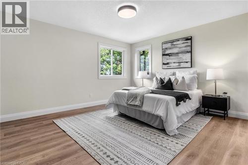 Wood-finish flooring, recessed ceiling lighting, and multiple windows - 46 Esther Avenue, Cambridge, ON 