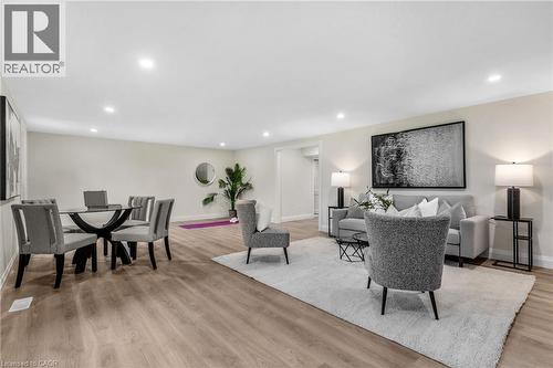 Open-concept living area featuring recessed lighting, wood-finish flooring, and light-toned walls - 46 Esther Avenue, Cambridge, ON 