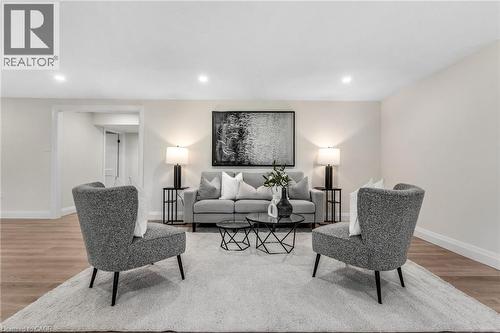Recessed ceiling lighting illuminates light-toned walls and wood-finish flooring - 46 Esther Avenue, Cambridge, ON 