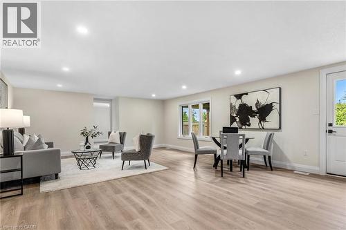 Recessed lighting illuminating the expansive room with wood-finish flooring - 46 Esther Avenue, Cambridge, ON 