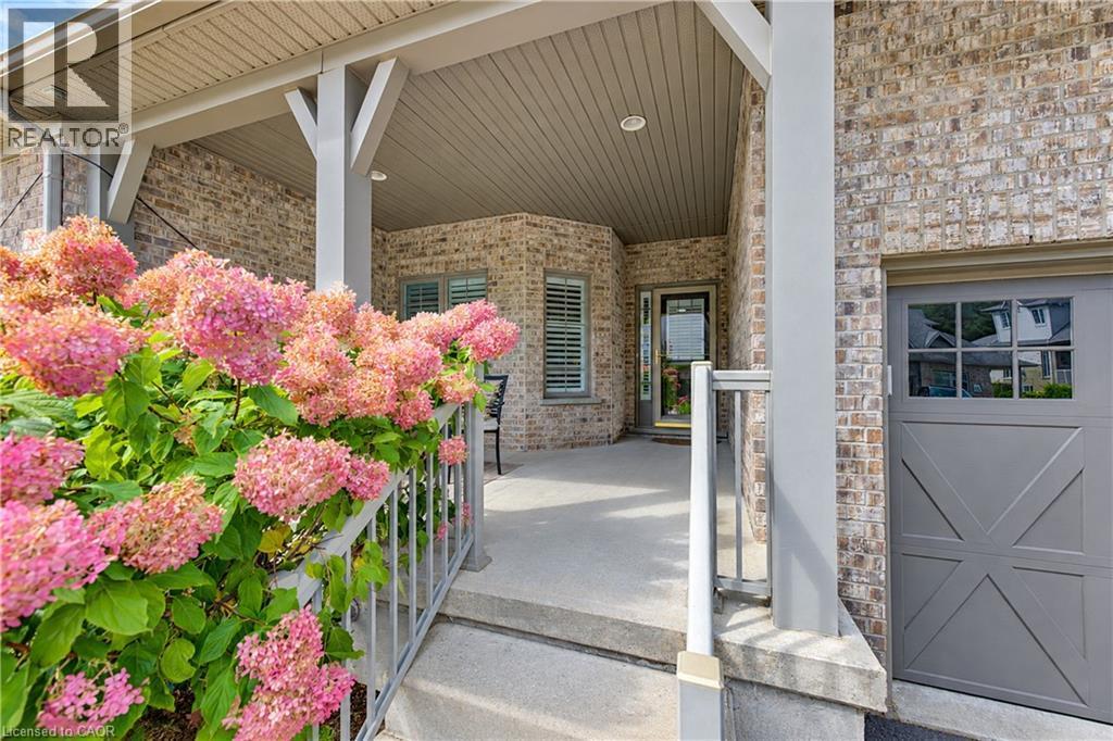 Front covered porch, vinyl low maintenance hand rails. - 222 Chestnut Hill Crescent, Kitchener, ON