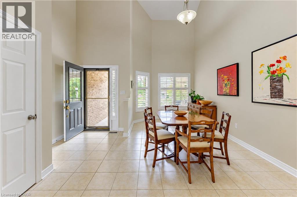 Welcome! Cathedral ceiling entry with dining area & coat closet. - 222 Chestnut Hill Crescent, Kitchener, ON