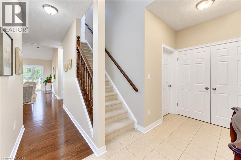 Main floor hallway with stairs to loft. - 222 Chestnut Hill Crescent, Kitchener, ON