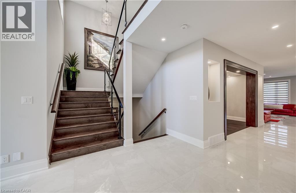 Glossy tiled flooring - 61 Schweitzer Street, Kitchener, ON