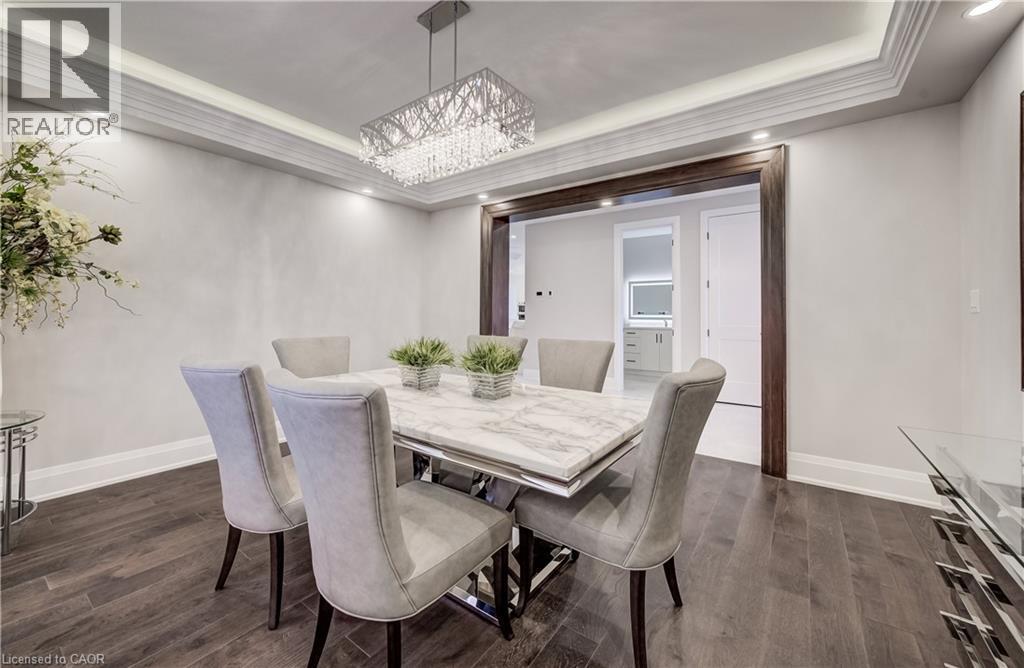 Elegant formal Dining room with tray ceiling lighting - 61 Schweitzer Street, Kitchener, ON