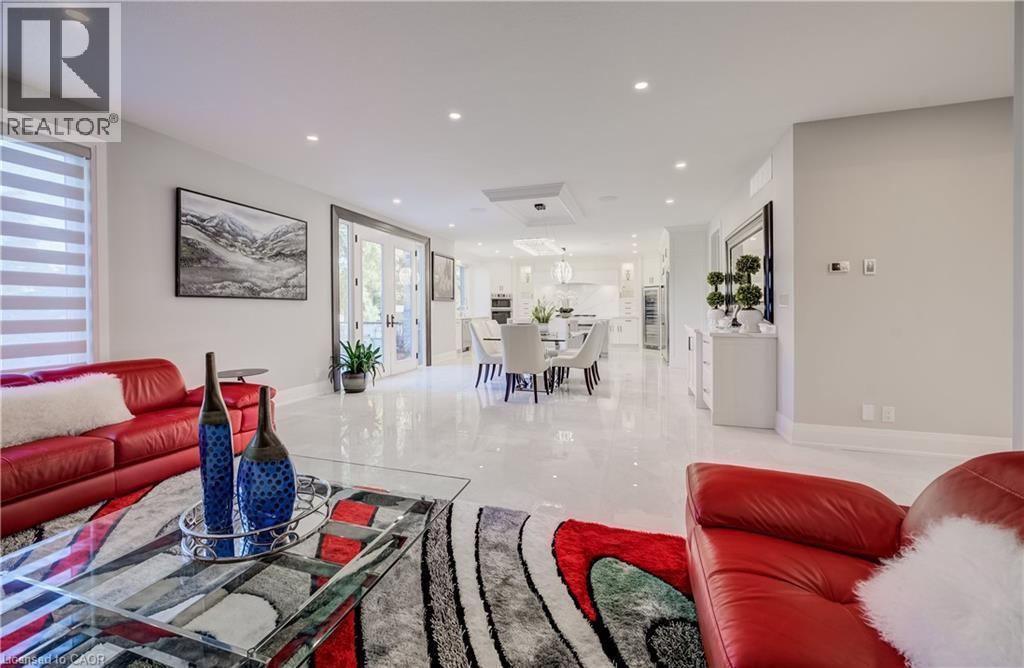 View from Living room to Breakfast area to Kitchen - 61 Schweitzer Street, Kitchener, ON