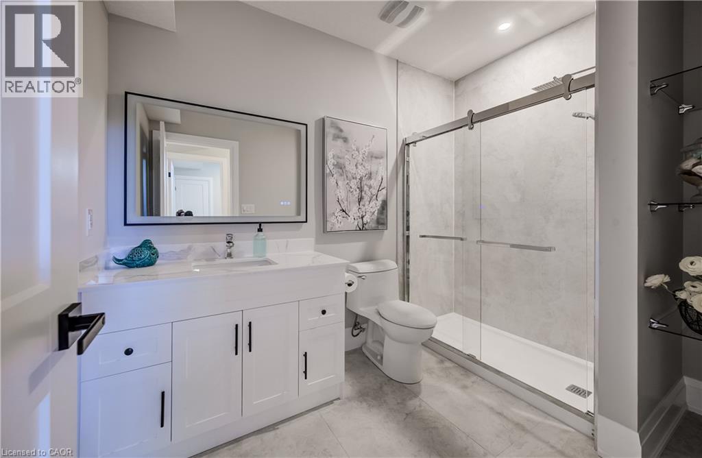 Basement 3 pc bathroom with walk-in shower and side open shelving - 61 Schweitzer Street, Kitchener, ON