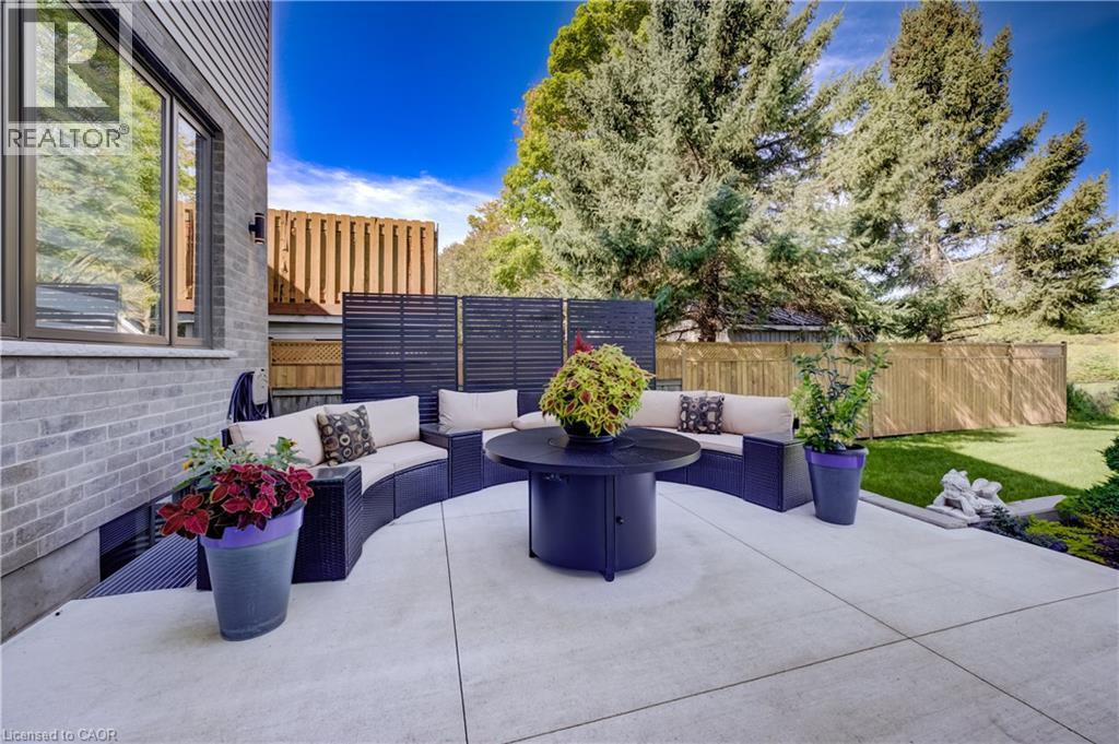 Rough-in for future hot tub with ready concrete pad or sitting area to relax and entertain - 61 Schweitzer Street, Kitchener, ON