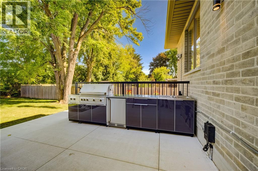 Outdoor meal prep station with beverage cooler, gas BBQ and storage - 61 Schweitzer Street, Kitchener, ON
