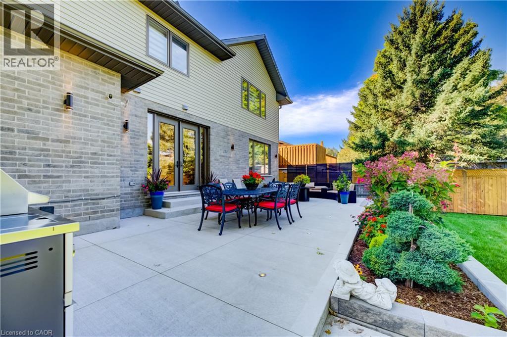 Patio view of entertaining areas - 61 Schweitzer Street, Kitchener, ON